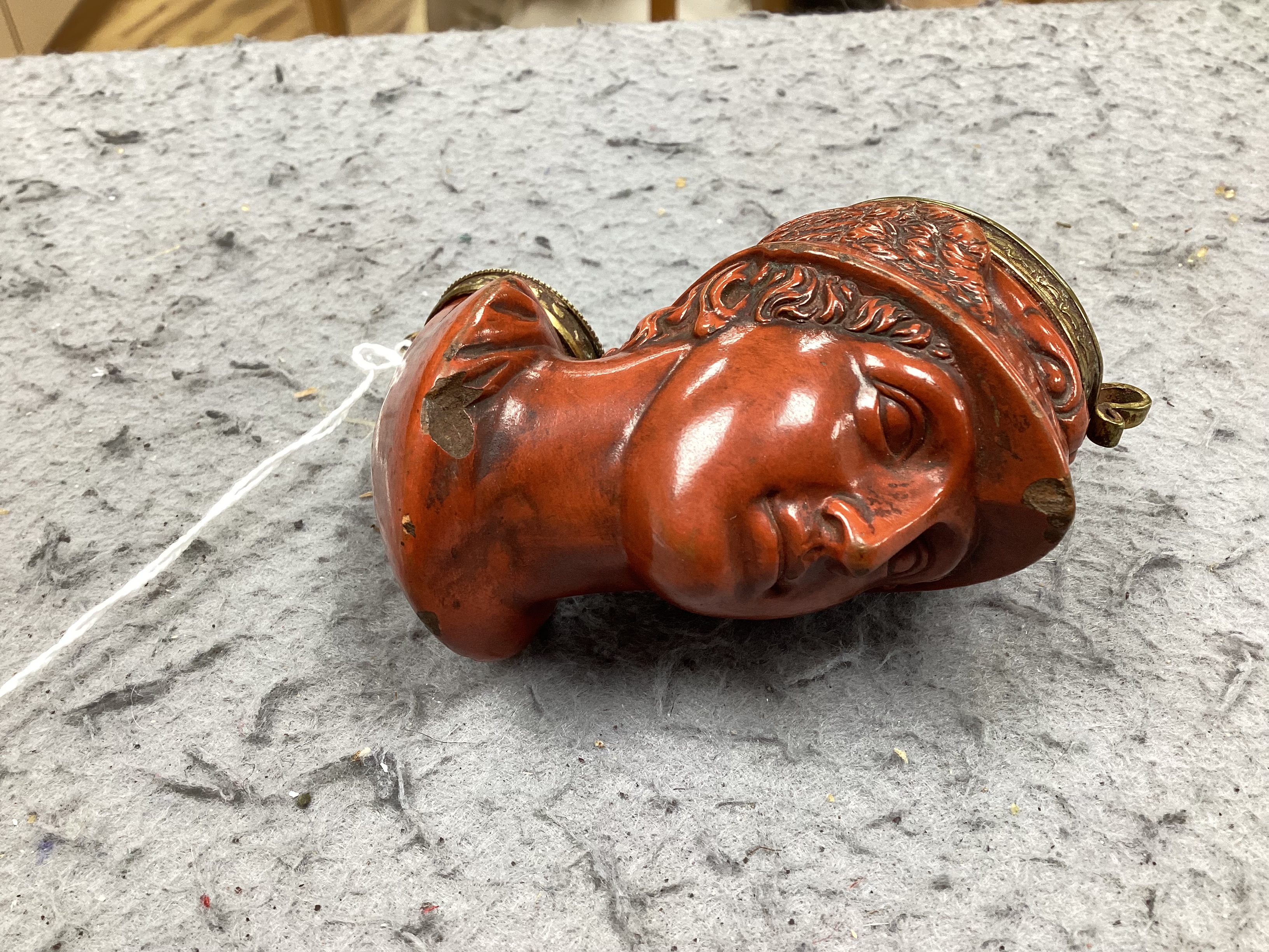A 19th-century French terracotta pipe modelled as the bust of Hermes, approximately 10cm high